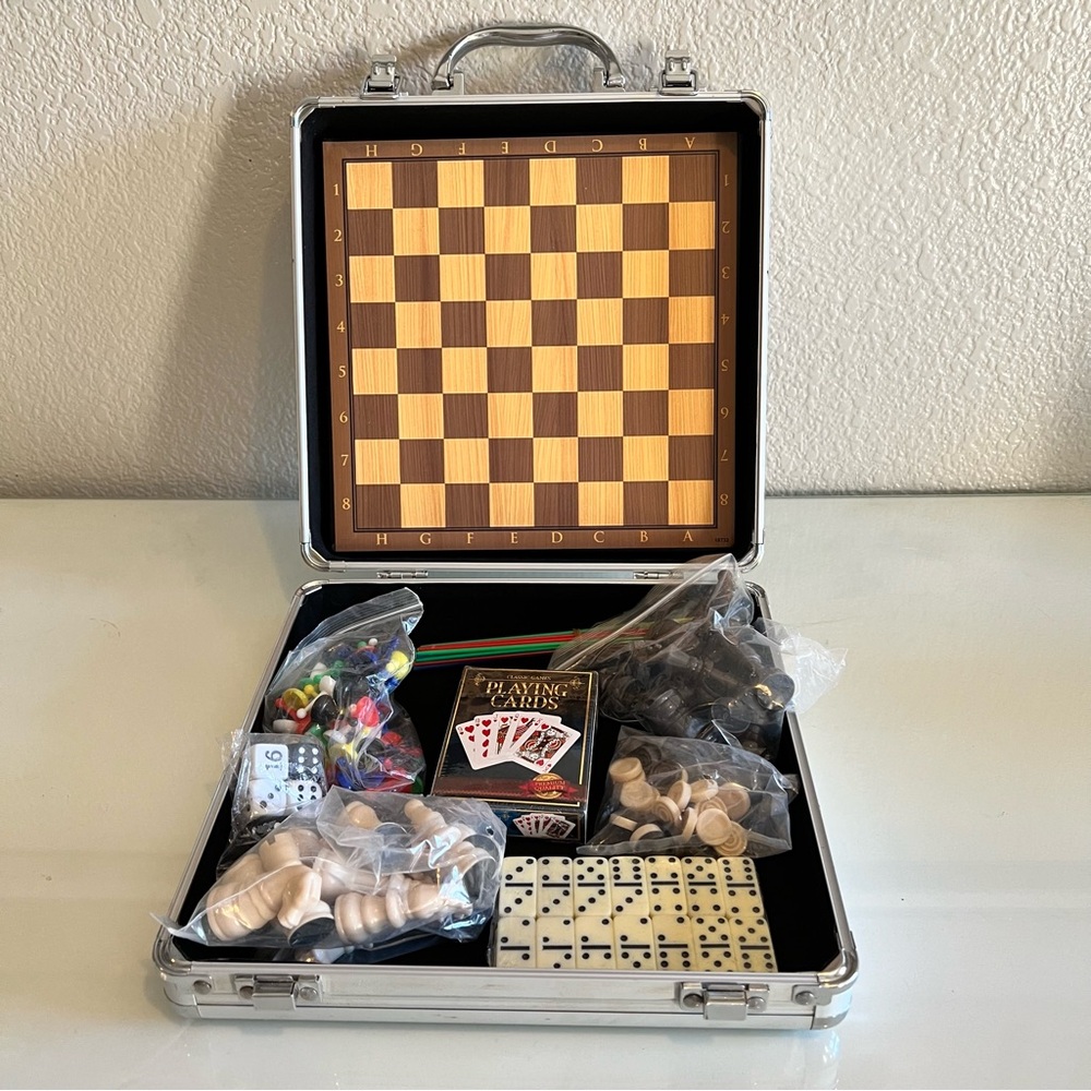 This Is a Multi-Game Set with case. All Game Pieces are still sealed. 5 Games.